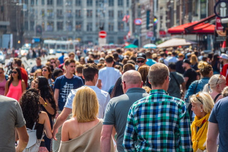 Huge crowd of people at Damrak Street in Amsterdamのeditorial素材