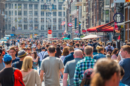 Huge crowd of people at Damrak Street in Amsterdamのeditorial素材