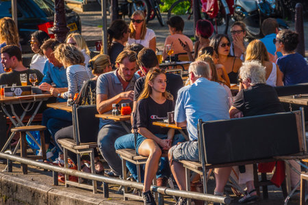 Street cafe at the canals of Amsterdam on a sunny dayのeditorial素材