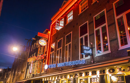 The colorful illuminated buidlings at Leidse Square Amsterdamのeditorial素材