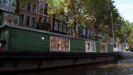 House boats in the canals of Amsterdam - AMSTERDAM - THE NETHERLANDS - JULY 19, 2017のeditorial素材