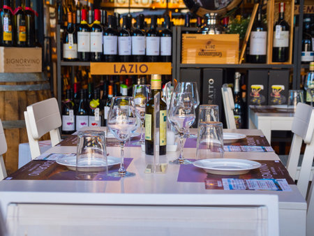 Beautiful decorated table in a wine bar and restaurant in Florence - FLORENCE / ITALY - SEPTEMBER 12, 2017のeditorial素材