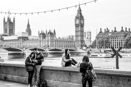 Tourists taking photos in front of Houses of Parliament and Westminster Bridge - a tourist attraction in London - LONDON / GREAT BRITAIN - SEPTEMBER 19, 2016のeditorial素材