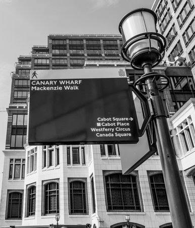 Direction signs at Canary Wharf at MacKenzie Walk - LONDON / GREAT BRITAIN - SEPTEMBER 19, 2016のeditorial素材