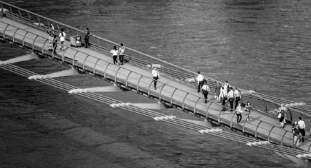 People walking over the Millennium Bridge in London - aerial view - LONDON / GREAT BRITAIN -...