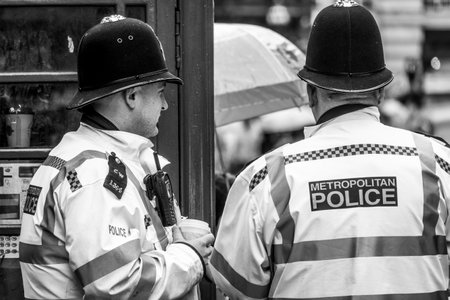 London Police Officers at Piccadilly Circus in London - LONDON / GREAT BRITAIN - SEPTEMBER 19, 2016のeditorial素材