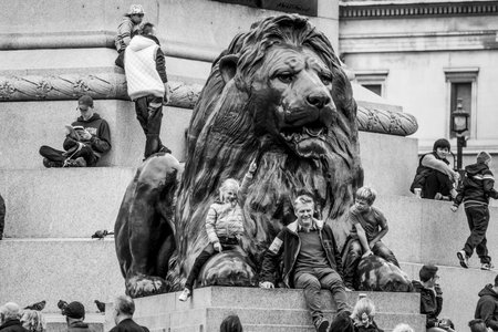 The lions at Trafalgar Square in London - popular place for tourists - LONDON / GREAT BRITAIN - SEPTEMBER 19, 2016のeditorial素材