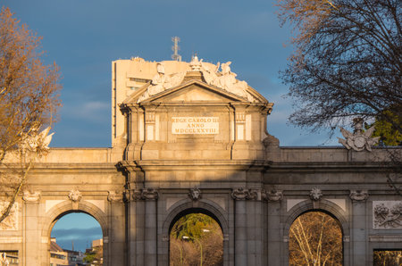 Famous gate in Madrid called Puerta de AlcalÃ¡ on a sunny day - MADRID / SPAIN - FEBRUAR 21, 2018のeditorial素材