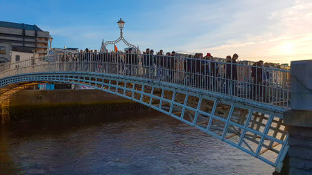 Most famous bridge in Dublin - the HaPenny Bridge over River Liffeyのeditorial素材