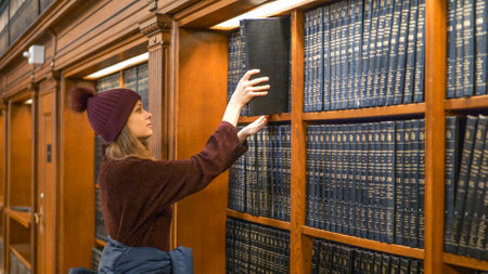 Young student in a library - NEW YORK, UNITED STATES - DECEMBER 4, 2018のeditorial素材