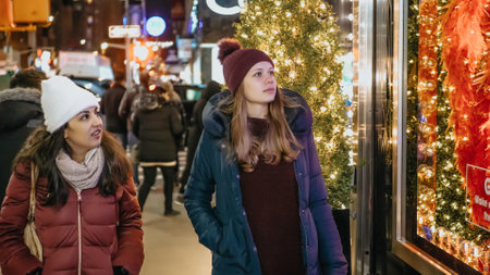 Young women in New York doing Christmas shopping on Fifth Avenue - NEW YORK, UNITED STATES - DECEMBER 4, 2018のeditorial素材