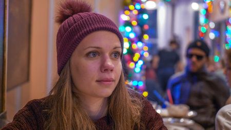 Young woman in a small cafe in New York City - NEW YORK, UNITED STATES - DECEMBER 4, 2018のeditorial素材