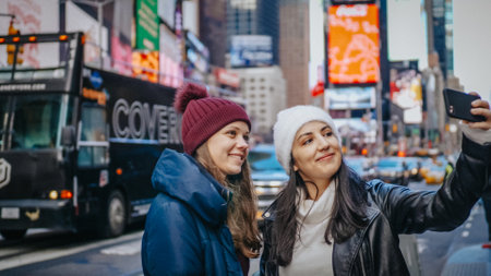 Two friends enjoy their vacation trip to New York - NEW YORK, UNITED STATES - DECEMBER 4, 2018のeditorial素材