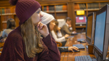 Two people surf the internet for research - NEW YORK, USA - DECEMBER 4, 2018のeditorial素材