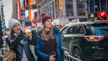 Two friends enjoy their vacation trip to New York - NEW YORK, UNITED STATES - DECEMBER 4, 2018のeditorial素材