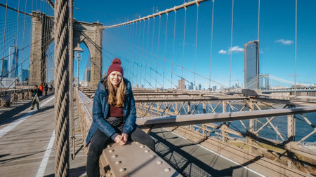 Relaxing at Brooklyn Bridge New York on a sunny day - NEW YORK -のeditorial素材