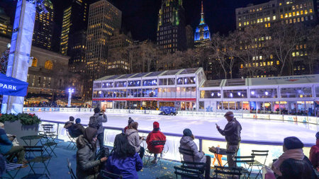 Huge ice rink at Bryant Park Manhattan by night - NEW YORK, USAのeditorial素材