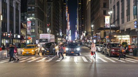 Street crossing in New York by night typical view for Manhattanのeditorial素材