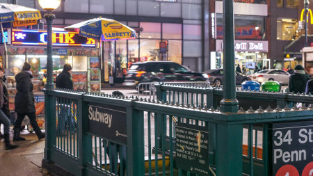 Manhattan subway entrance at night - NEW YORK, UNITED STATES - DECEMBER 4, 2018のeditorial素材