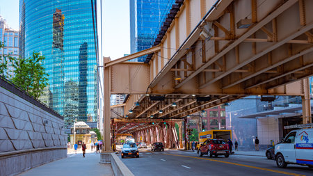 Typical street view in Chicago with subway tracks - CHICAGO, USA - JUNE 11, 2019