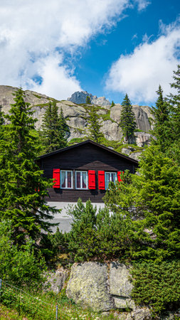 Typical Swiss hut in the alps - SWISS ALPS, SWITZERLAND - JULY 22, 2019のeditorial素材