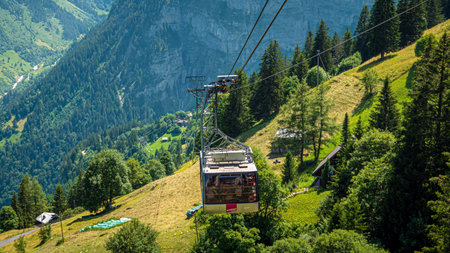 Swiss Skyline Telefric called Schilthornbahn in the Swiss Alps - SWISS ALPS, SWITZERLAND - JULY 22, 2019のeditorial素材