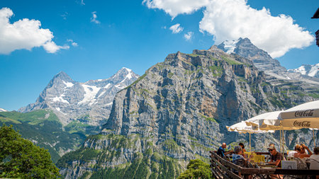 Amazing view over the Eiger and Moench mountains in Switzerland - SWISS ALPS, SWITZERLAND - JULY 22, 2019のeditorial素材