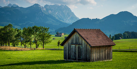 Wooden hut in Switzerland - typical view in the Swiss Alps - SWISS ALPS, SWITZERLAND - JULY 22, 2019のeditorial素材