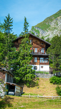 Beautiful houses in the nature of Maloja - SWISS ALPS, SWITZERLAND - JULY 22, 2019