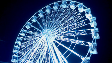 Carousels at amusement fair at night - CARDIFF, WALES - DECEMBER 31, 2019のeditorial素材