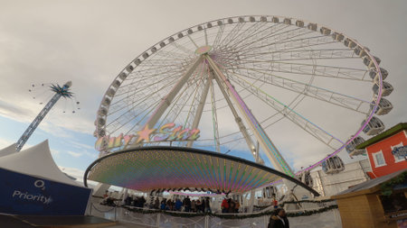 Wide angle view of a Ferris Wheel at the fair - LONDON, ENGLAND - DECEMBER 10, 2019のeditorial素材