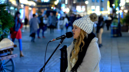 female Street musician at Covent Garden London - LONDON, ENGLAND - DECEMBER 10, 2019