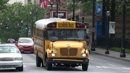School Bus driving throgh Atlanta midtown - ATLANTA, USA - APRIL 22, 2016