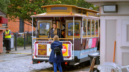 Taking photos at the San Francisco Cable Car - very popular in San Francisco - SAN FRANCISCO, CALIFORNIA - APRIL 18, 2017 - travel photographyのeditorial素材