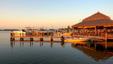 Small pier on the USA Keys in the evening sun- ISLAMORADA, USA - APRIL 12, 2016のeditorial素材