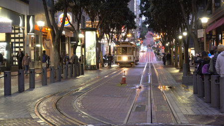 Cable Car in San Francisco - street view at night - SAN FRANCISCO, UNITED STATES - APRIL 21, 2017のeditorial素材