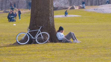 Relaxing at Central Park Manhattan New York - NEW YORK CITY, USA - APRIL 2, 2017のeditorial素材