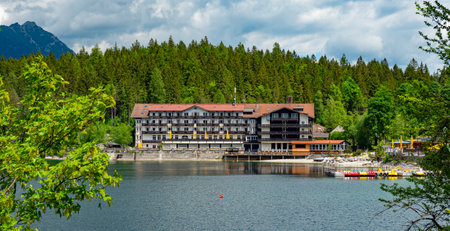 Famous Eibsee Hotel in Grainau at Zugspitze mountain - GRAINAU, GERMANY - MAY 26, 2020のeditorial素材
