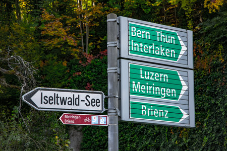 Direction signs to Bern Thun and Interlaken in Switzerland - COUNTY OF BERN. SWITZERLAND - OCTOBER 9, 2020のeditorial素材