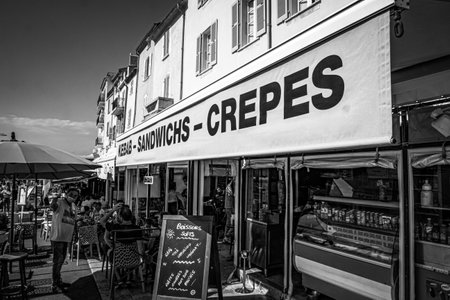 Bars and restaurants at the port of Saint Tropez- ST TROPEZ, FRANCE - JULY 13, 2020のeditorial素材