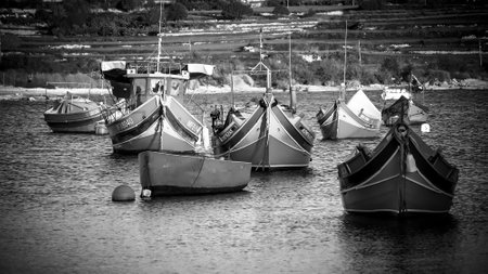 Colorful fisher boats in the bay of Marsaxlokk in Malta - MALTA, MALTA - MARCH 5, 2020のeditorial素材
