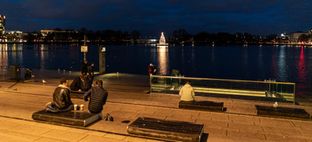Famous street Jungfernstieg in the city center of Hamburg by night - HAMBURG, GERMANY - DECEMBER 25,...