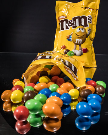 A package of M and Ms Peanuts - a sweet snack close up view - CITY OF FRANKFURT, GERMANY - MARCH 23, 2021のeditorial素材