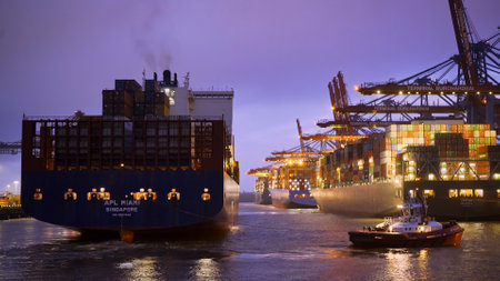 Port of Hamburg Container Terminal by night - Timelapse shot - HAMBURG, GERMANY - MAY 11, 2021