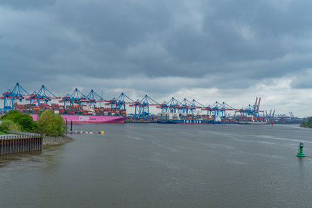 Port of Hamburg with its huge container cranes - CITY OF HAMBURG, GERMANY - MAY 10, 2021のeditorial素材