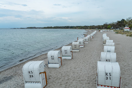 Beach baskets on the Baltic Sea - famous Travemunde beach in Germany - CITY OF LUBECK, GERMANY - MAY 10, 2021のeditorial素材