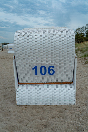 Beach baskets on the Baltic Sea - famous Travemunde beach in Germany - CITY OF LUBECK, GERMANY - MAY 10, 2021のeditorial素材