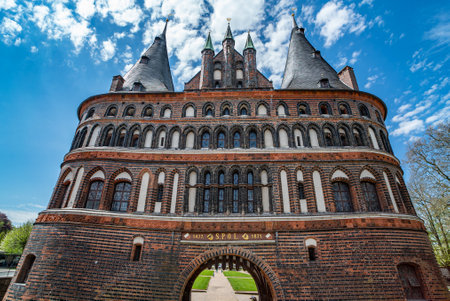 Famous Holsten Gate in the city of Lubeck Germany - CITY OF LUBECK, GERMANY - MAY 10, 2021のeditorial素材