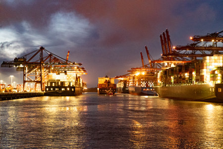 Port of Hamburg with its huge container terminals by night - CITY OF HAMBURG, GERMANY - MAY 10, 2021のeditorial素材