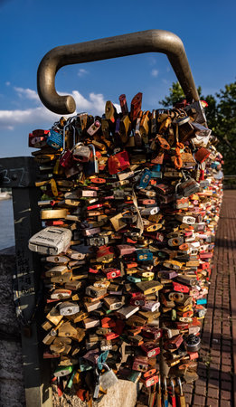 Locks attached to a bridge as a sign of love - CITY OF COLOGNE, GERMANY - JUNE 25, 2021のeditorial素材